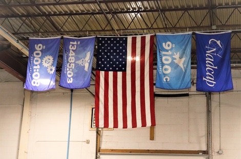 American Flag hanging with quality standards and certifications flags