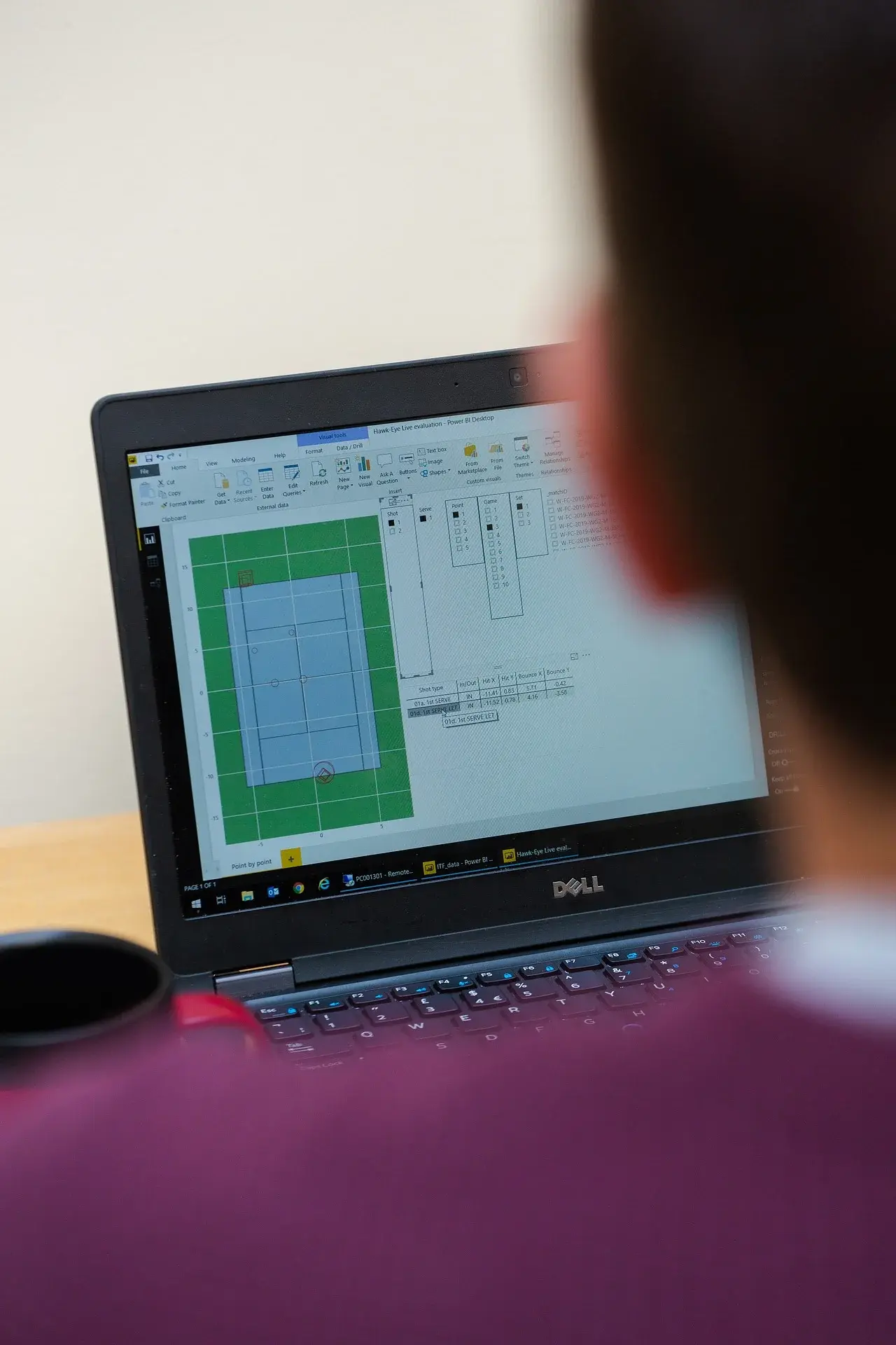 Designer using CAD software to create 3D designs
