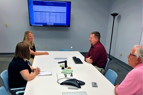 The Technology House Team meeting in conference room